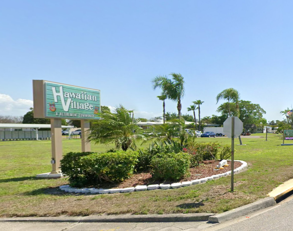 Entrance sign and landscaping at Hawaiian Village MHP